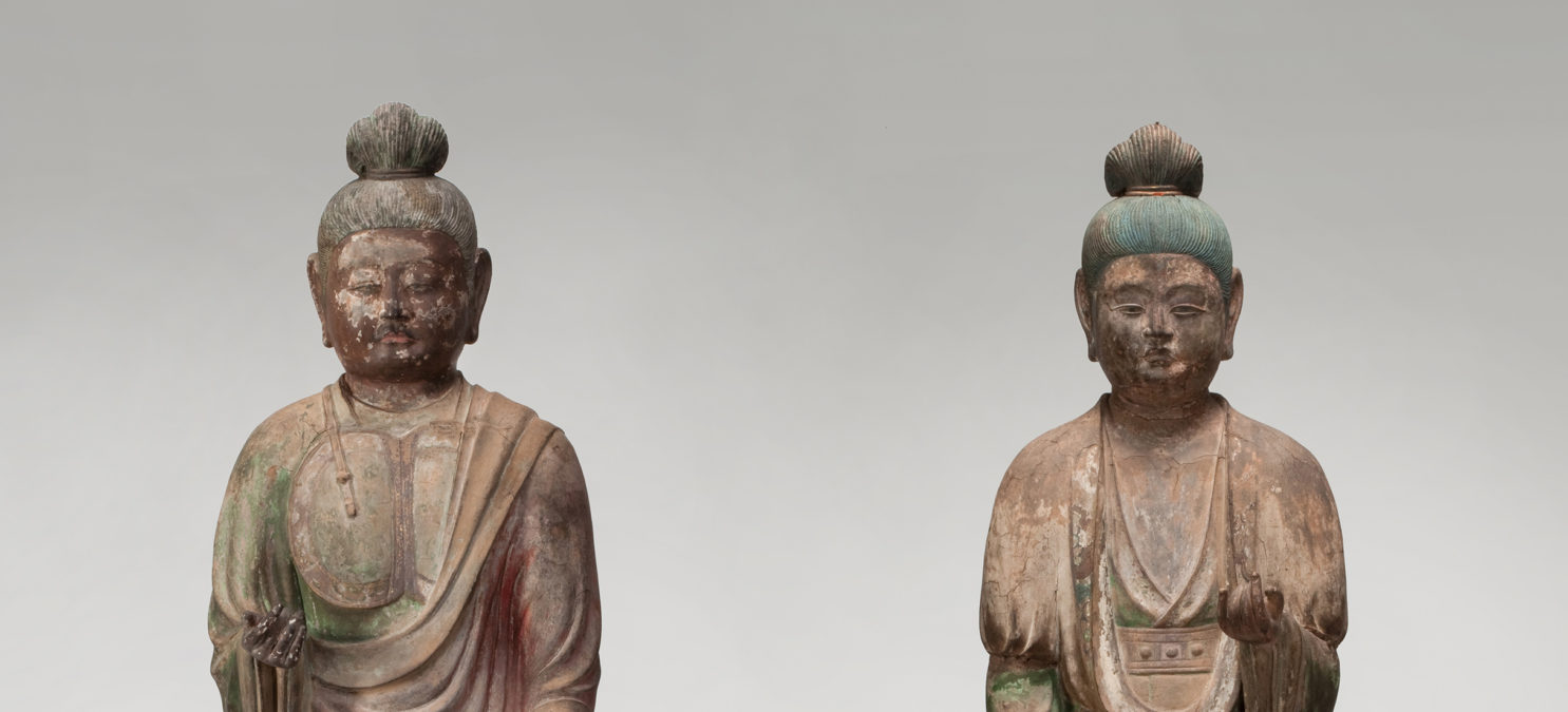 Two standing temple guardian statues